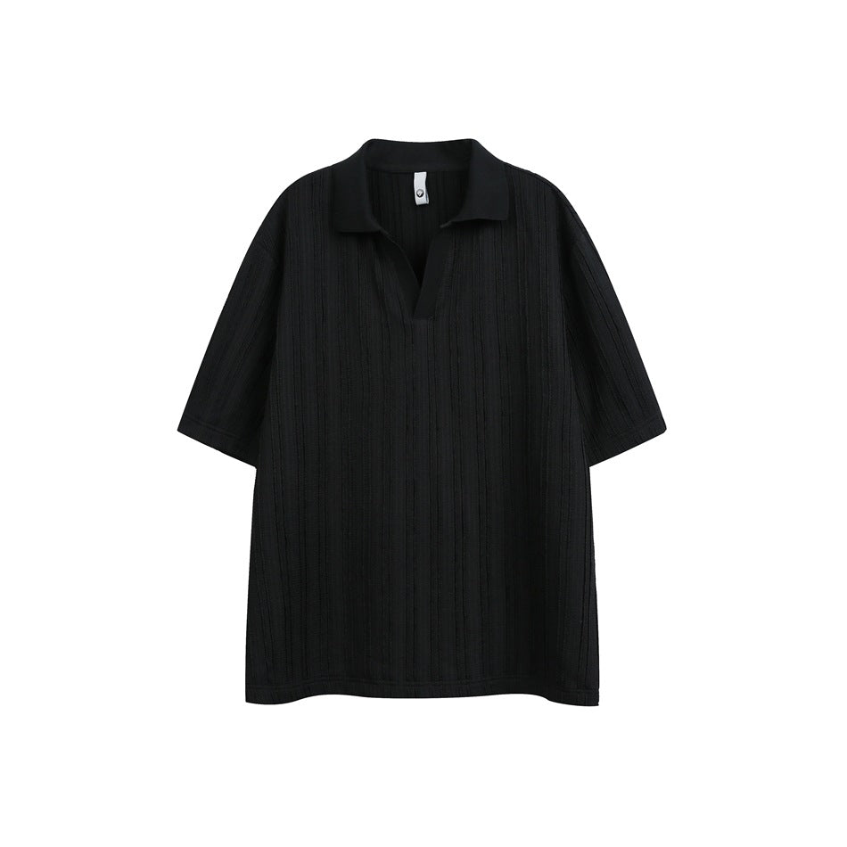 Black short-sleeve polo-style top with textured vertical stripes and open V-neck collar, flat lay