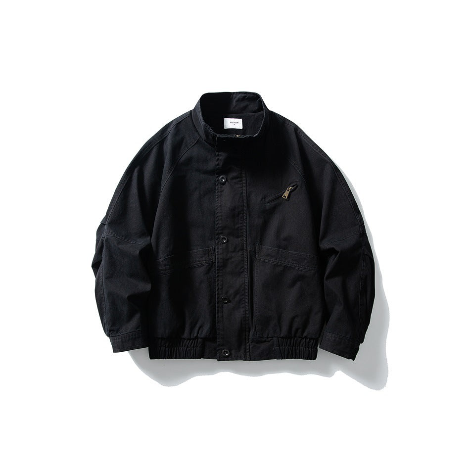Black stand-collar jacket flat lay, front view, with snap placket, chest zip pocket, large pockets and elastic hem