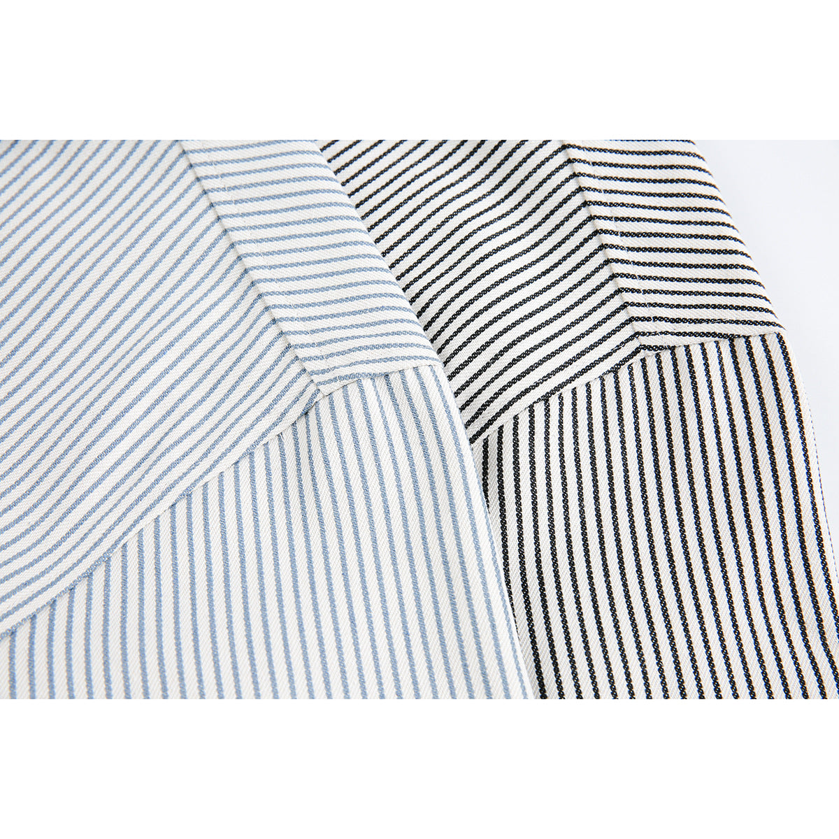 Close-up comparison of fine blue-gray and black stripes, showing the fabric and a folded seam.