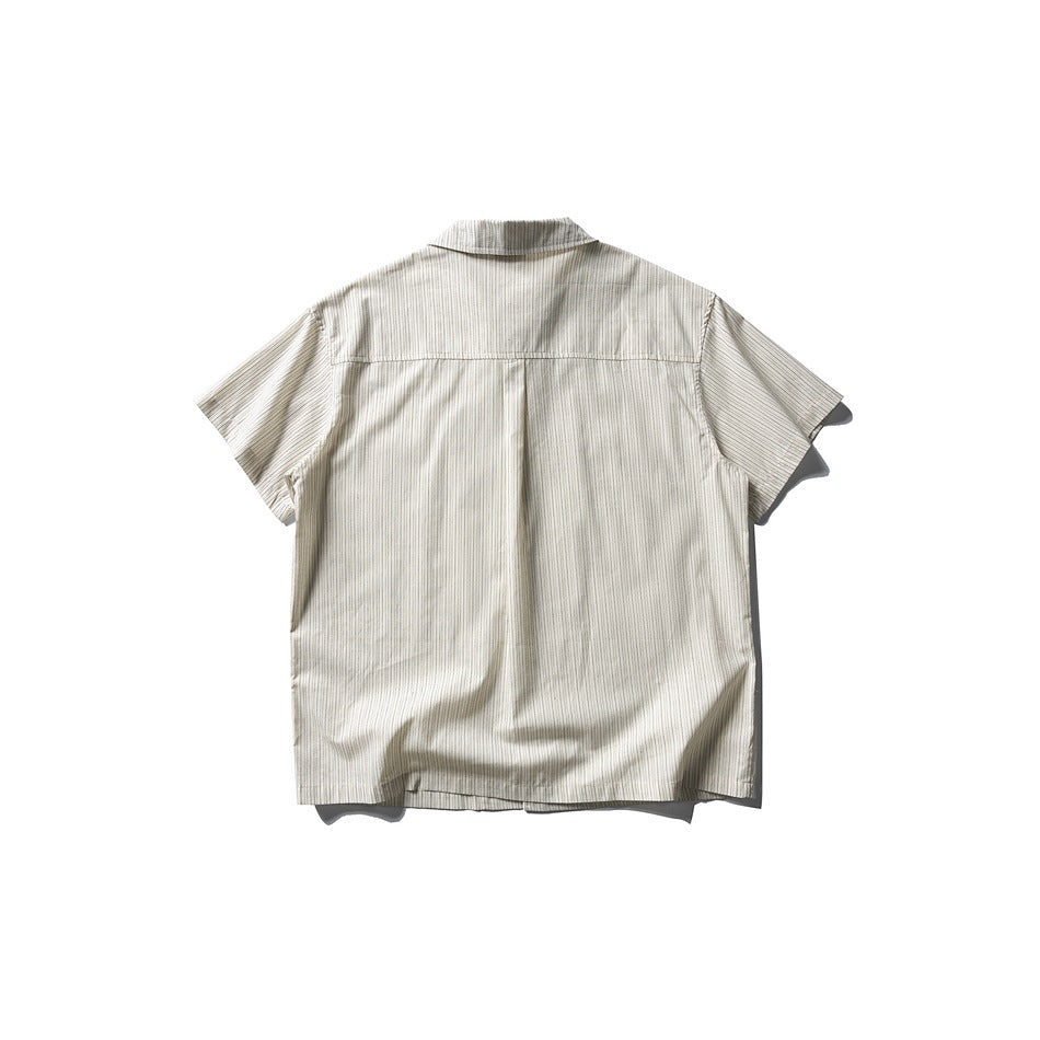 Back view of an apricot striped short-sleeve shirt with a yoke seam and center back pleat, flat lay