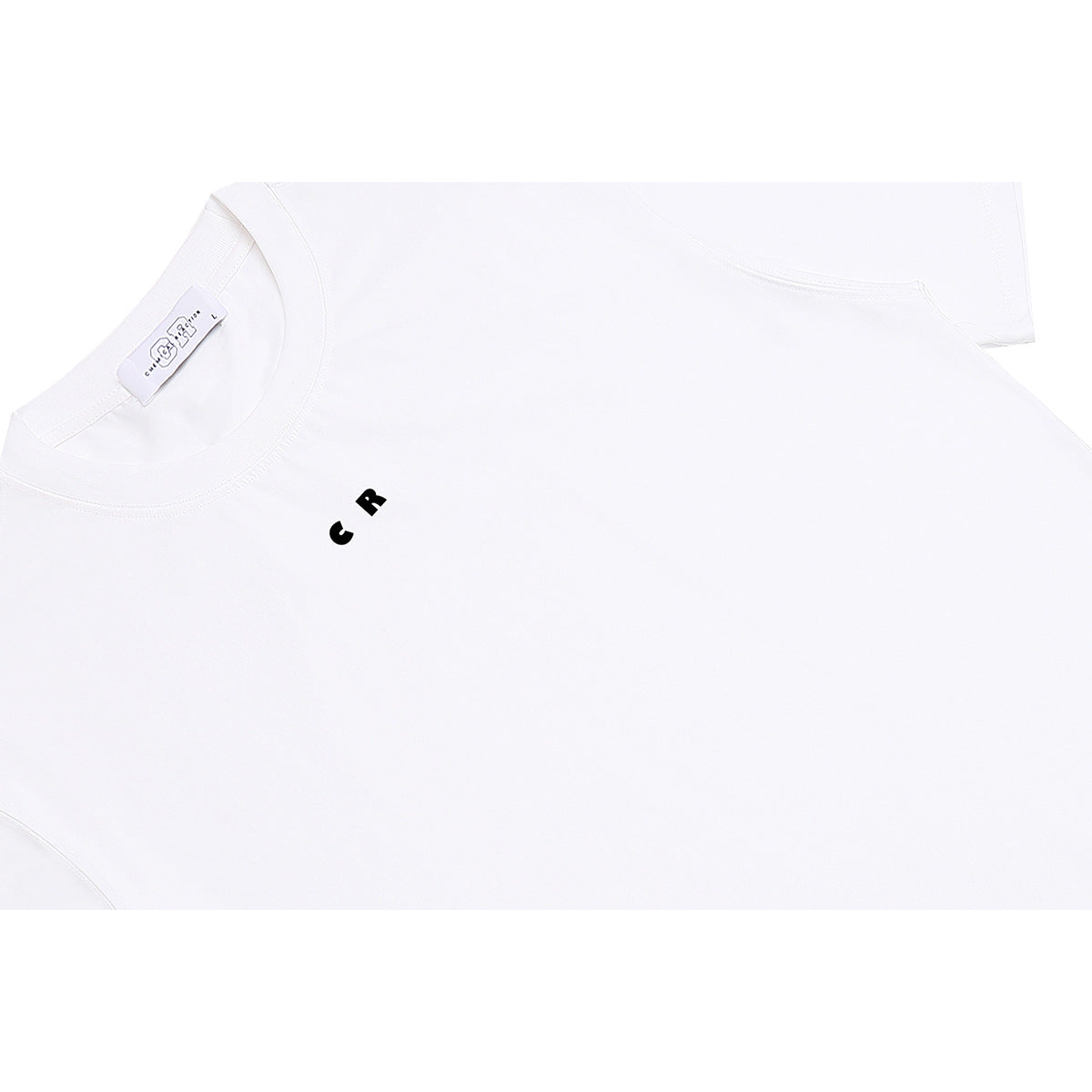 Close-up of a white crew-neck T-shirt with a small black CR chest mark and a visible neck label.