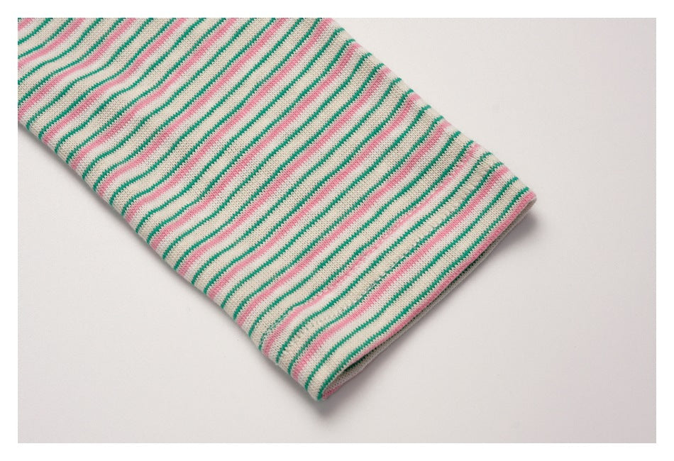 Close-up of the pink-and-green striped sleeve and its finished cuff.