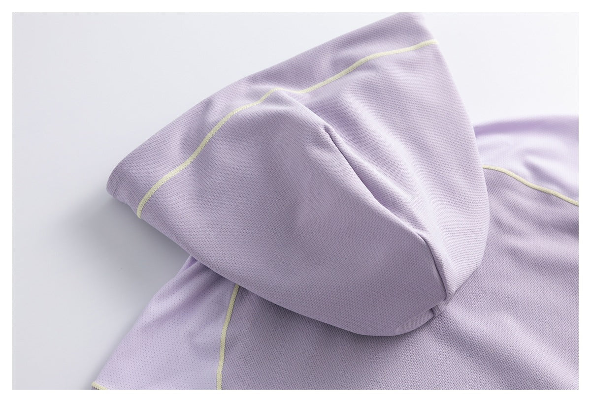 Folded lavender perforated garment fabric with pale yellow piping along the seam.