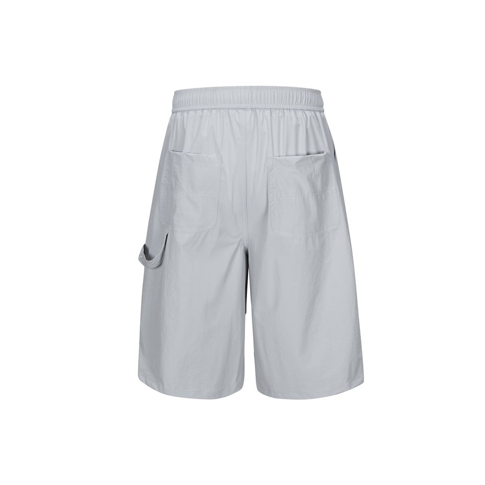 Back view of light gray knee-length shorts with two patch pockets and a loop at the side.