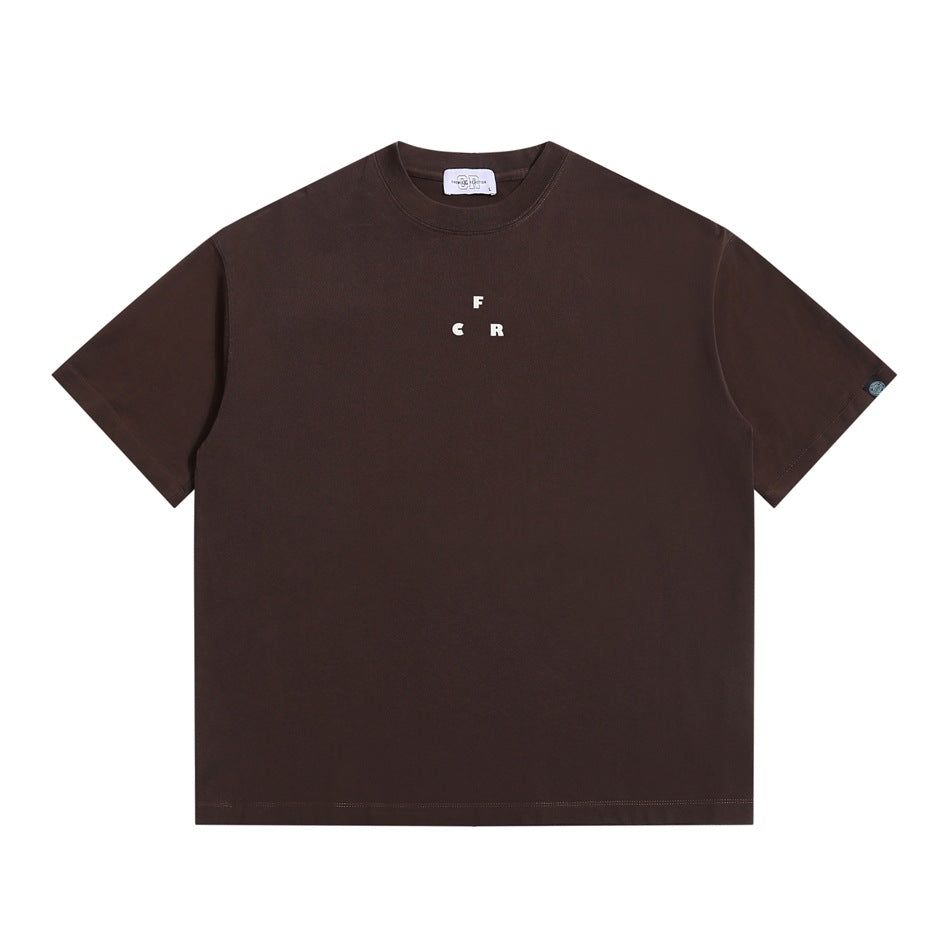 Brown short-sleeve crew-neck t-shirt, flat front view, small cream F C R letter print at center chest
