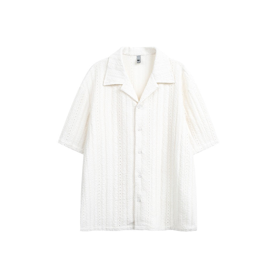 Off-white short-sleeve camp-collar shirt with button front and vertical eyelet stripe texture, flat lay