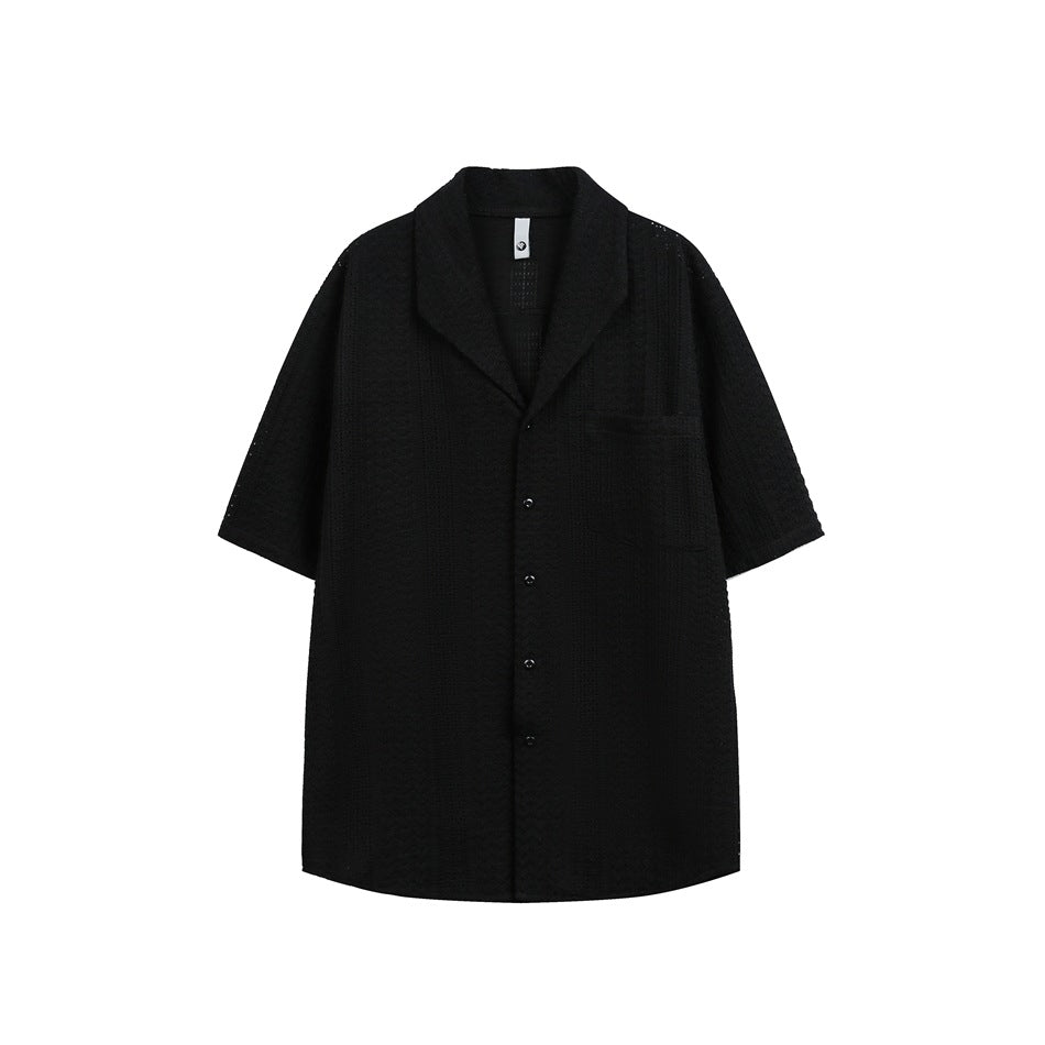 Black short-sleeve textured open-knit shirt with notched collar, chest pocket and button front, flat view