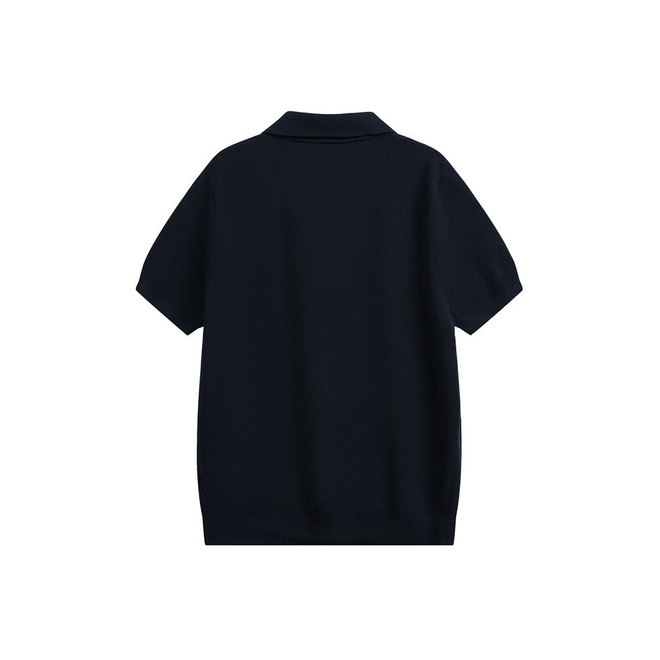 Back view of a dark navy short-sleeve polo shirt with a folded collar and ribbed hem.
