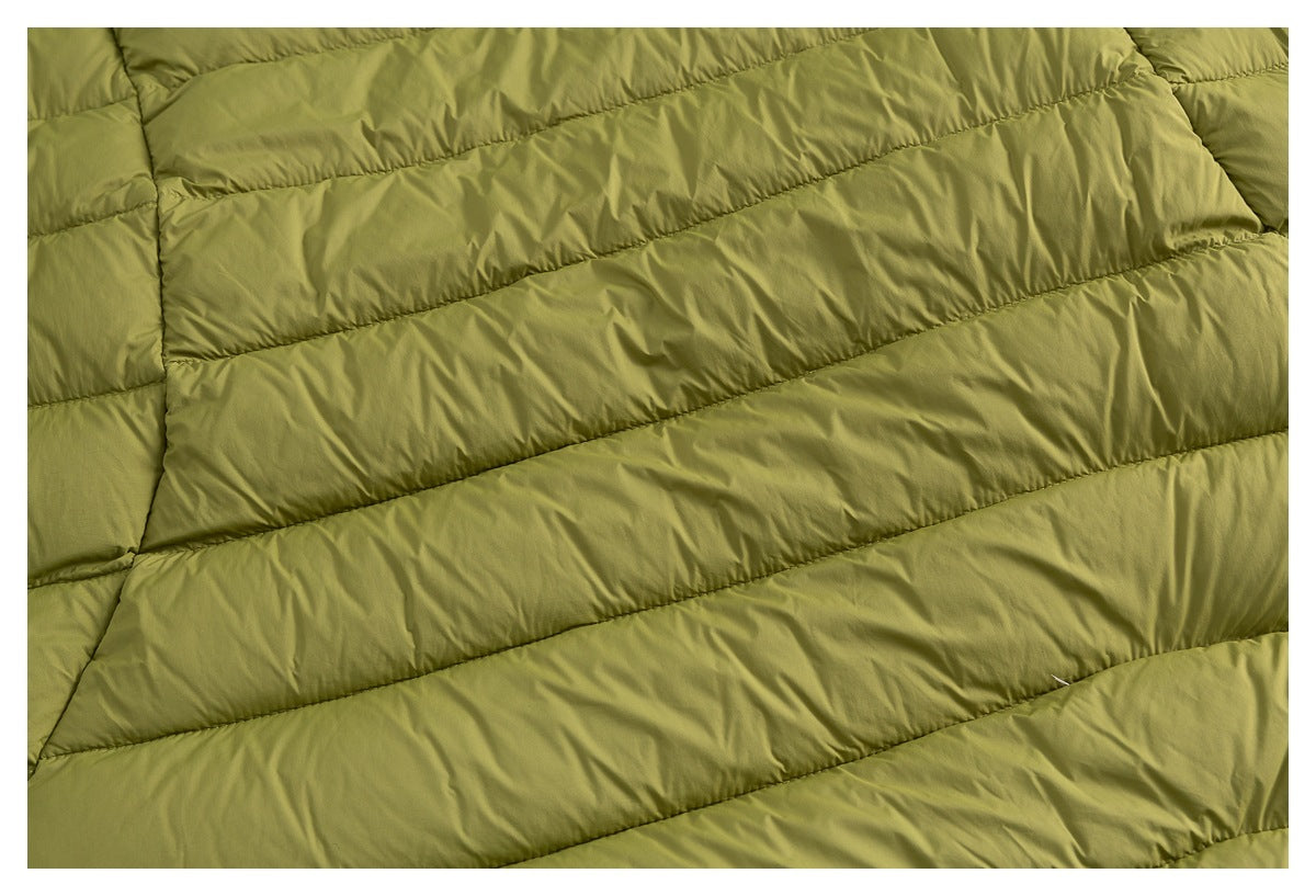 Close-up showing the olive-green garment's parallel padded channels and stitched seams.