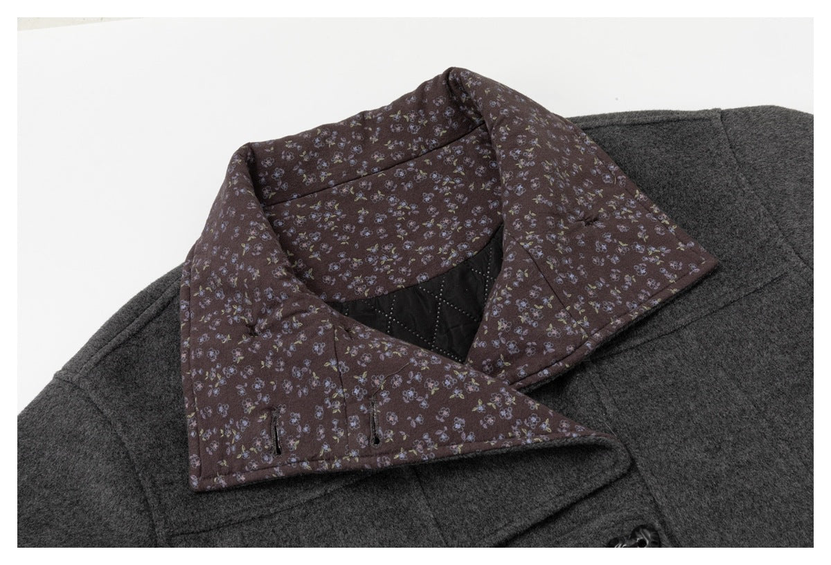 Close-up of the coat opened to show its floral-patterned collar lining and black quilted inner panel.