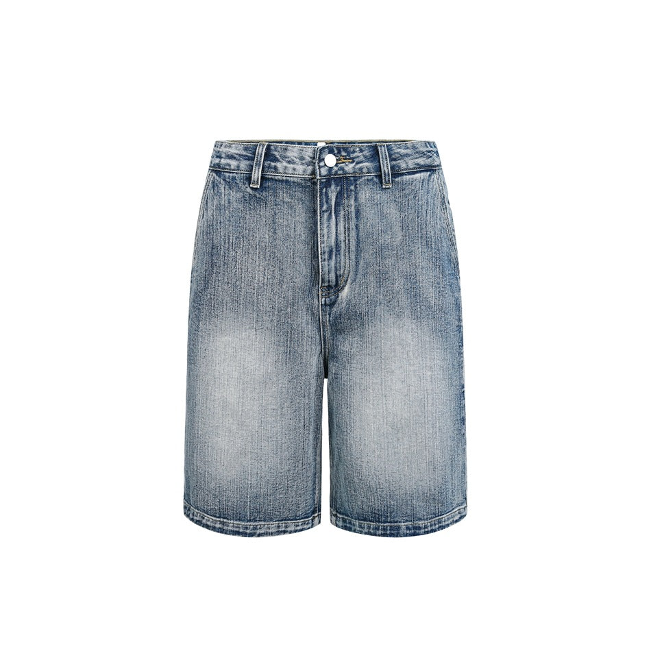 Front view of faded blue denim shorts with belt loops, a button closure, and a zip fly on white.