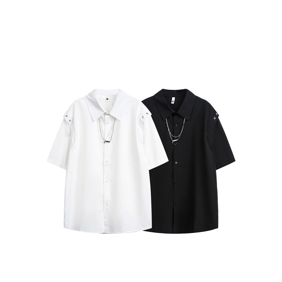 White and black short-sleeve button-up shirts displayed side by side, with snap details at the shoulders.