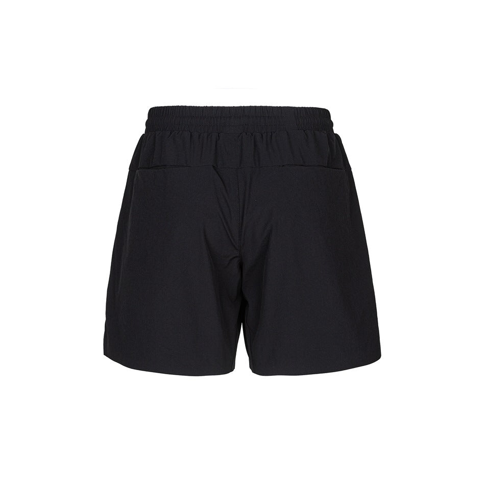 Back view of black shorts with an elastic waistband and a horizontal seam below it.
