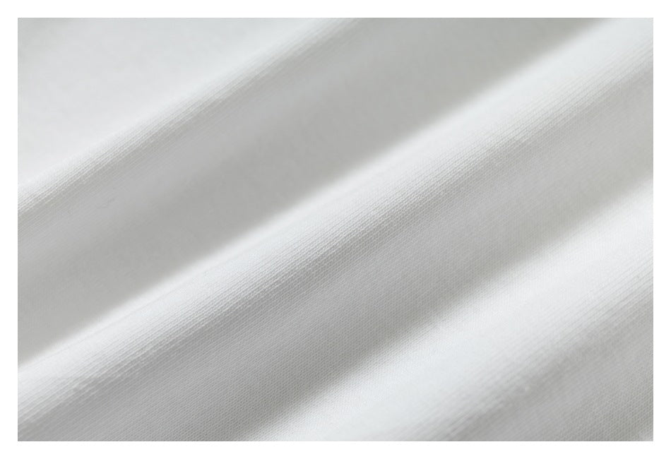 Macro view of the fine knit texture of white fabric.