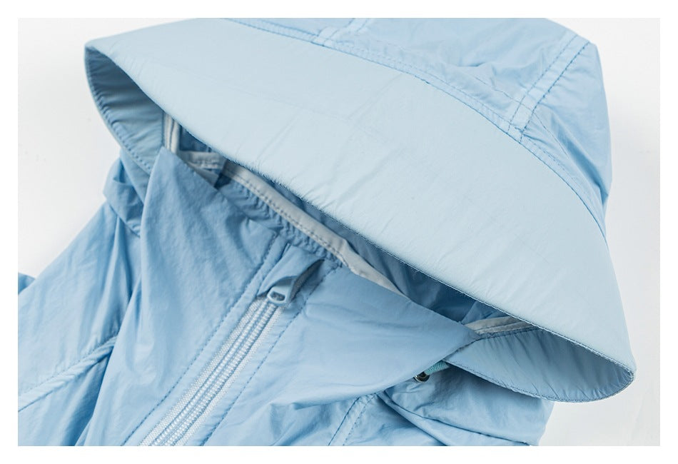 Light blue jacket hood and upper front shown close-up, with the hood brim and zipper visible.