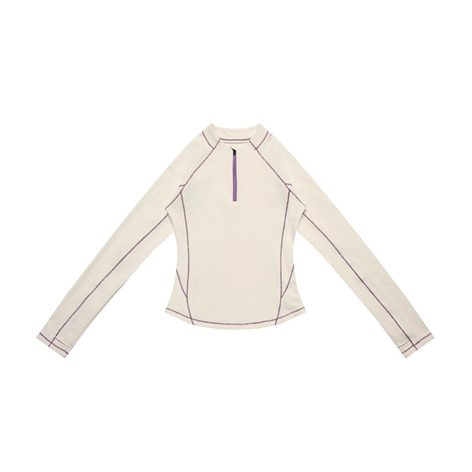 Off-white long-sleeve half-zip top with purple contrast stitching and zipper, laid flat, front view