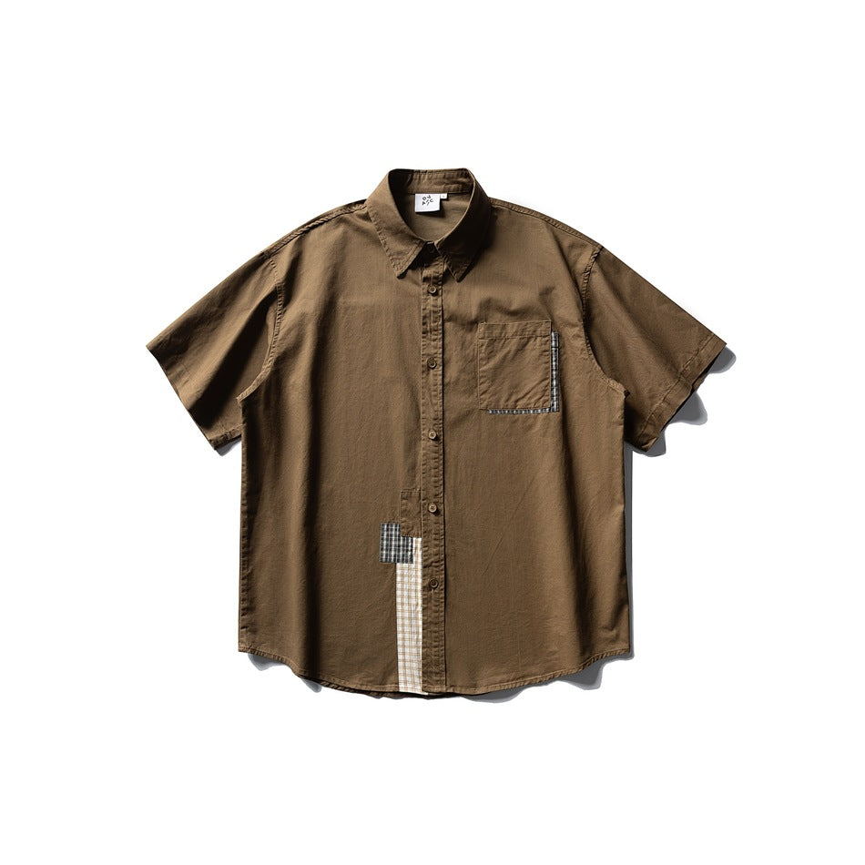Coffee brown short-sleeve button-up shirt with chest pocket and plaid patchwork trim, flat lay front view