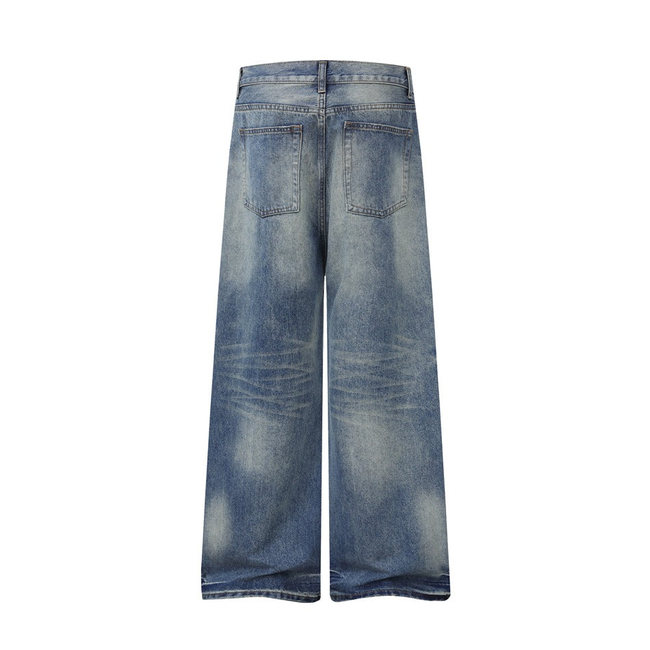 Rear view of light blue faded wide-leg jeans with two back pockets and visible crease fading.