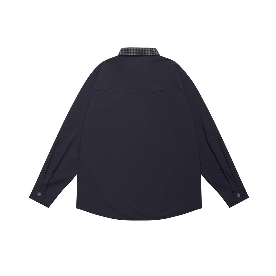 Back view of a dark navy long-sleeve shirt with a small plaid collar detail and buttoned cuffs.