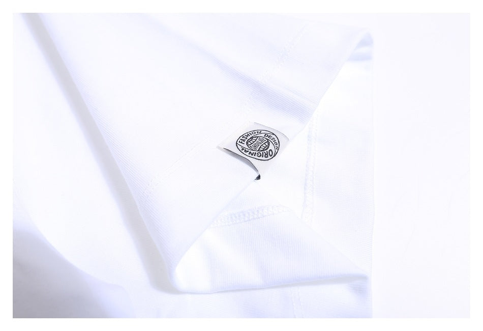 Close-up of a white T-shirt interior seam with a small fabric label.