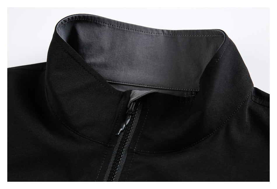 Close-up of the jacket's raised collar, inner gray panel, stitching, and front zipper.