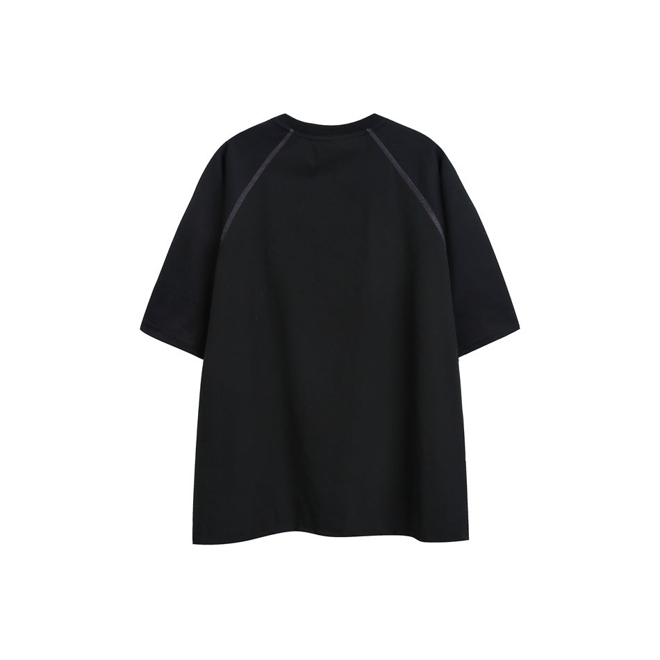 Back view of a black short-sleeve crew-neck T-shirt with raglan seams and subtle contrast stitching.