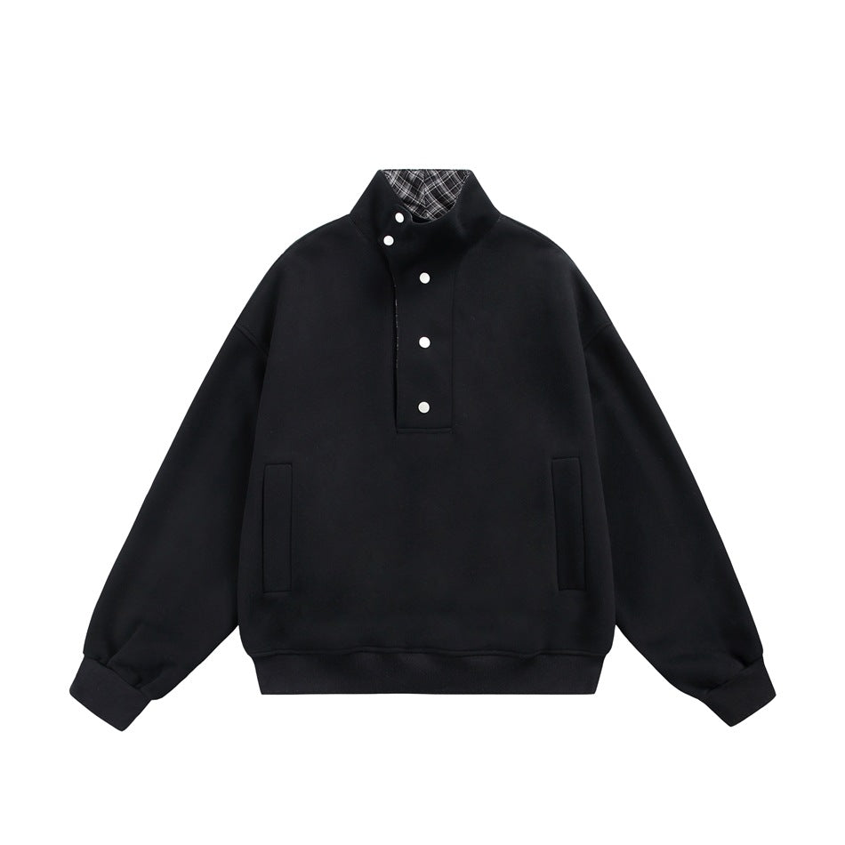 Black stand-collar sweatshirt flat lay with white snap buttons, slit pockets and ribbed cuffs