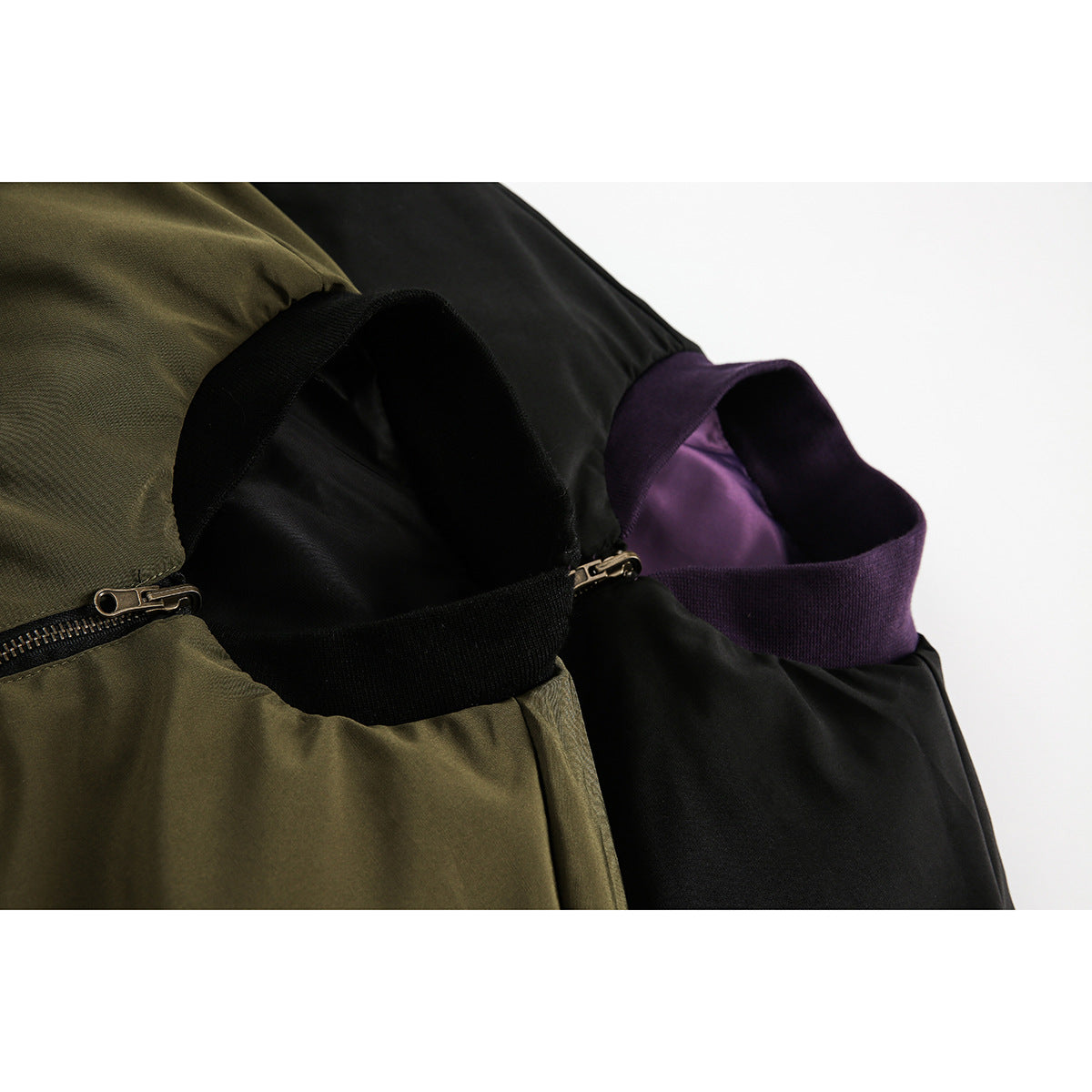 Close-up of bomber jacket collars and zippers in olive, black, and purple color combinations.