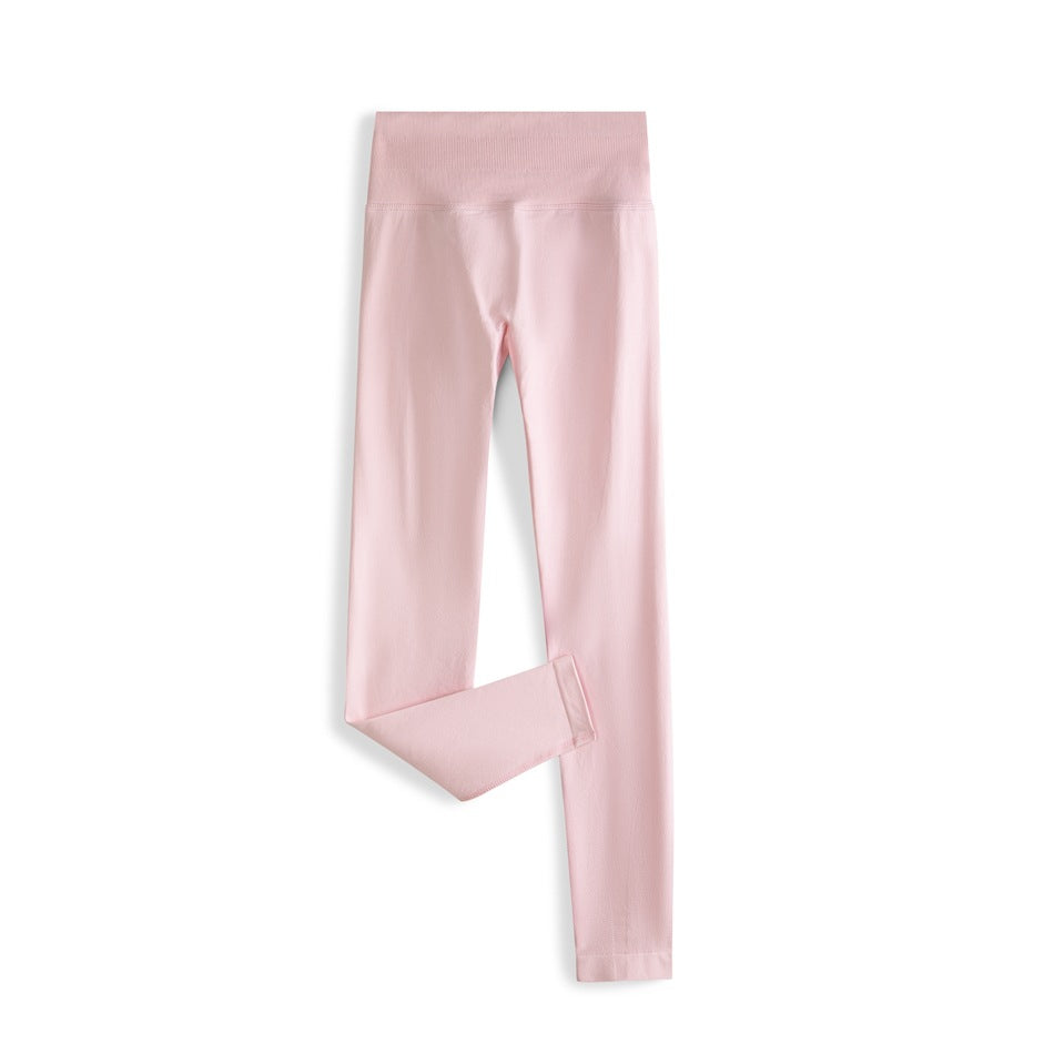 Light pink high-waisted ankle-length leggings laid flat with one leg folded