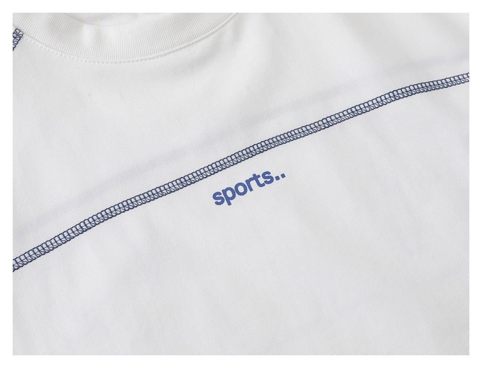 Close-up of a white shirt with a navy overlock seam and small blue “sports..” print.