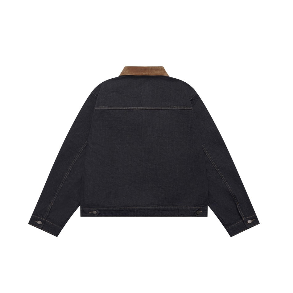 Back view of a dark indigo jacket with a brown collar, long sleeves, contrast seams and buttoned cuffs.