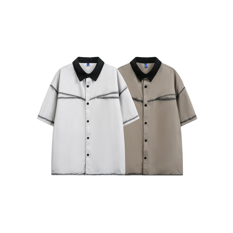 Front view of light gray and taupe short-sleeve button-up shirts with black collars and dark seam detailing.
