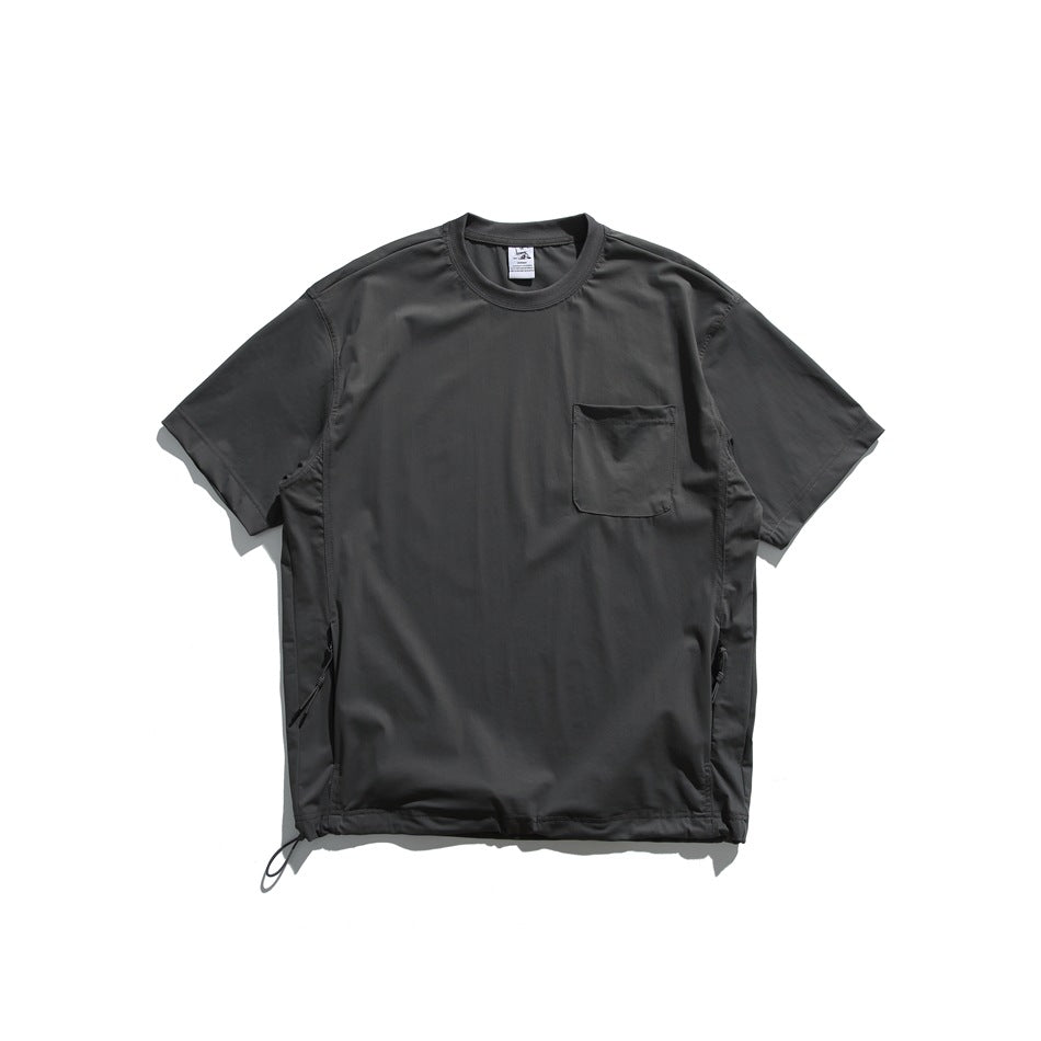Charcoal short-sleeve crew-neck shirt with a chest pocket, side zippers, and adjustable hem cords.