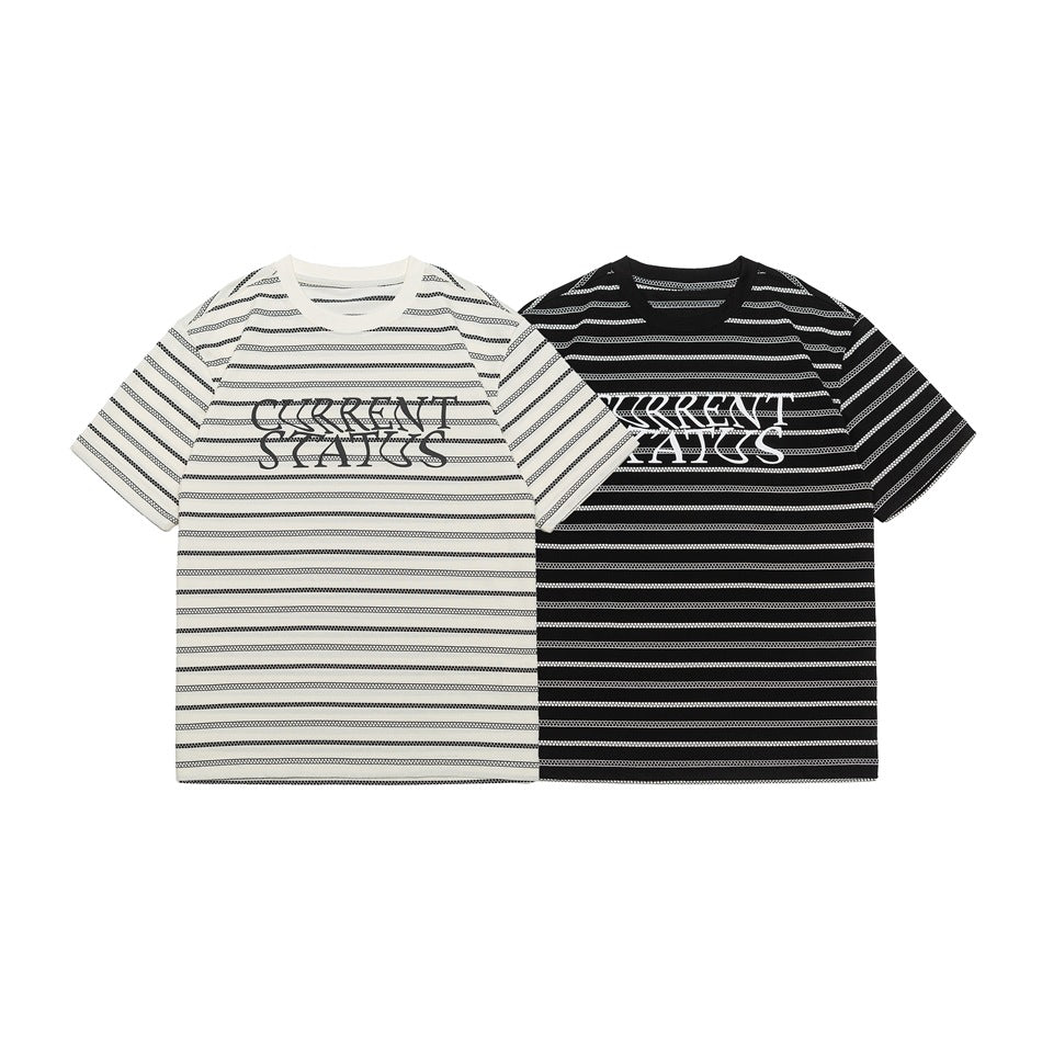Front view of ivory and black short-sleeve crew-neck T-shirts with horizontal patterned stripes and chest lettering.