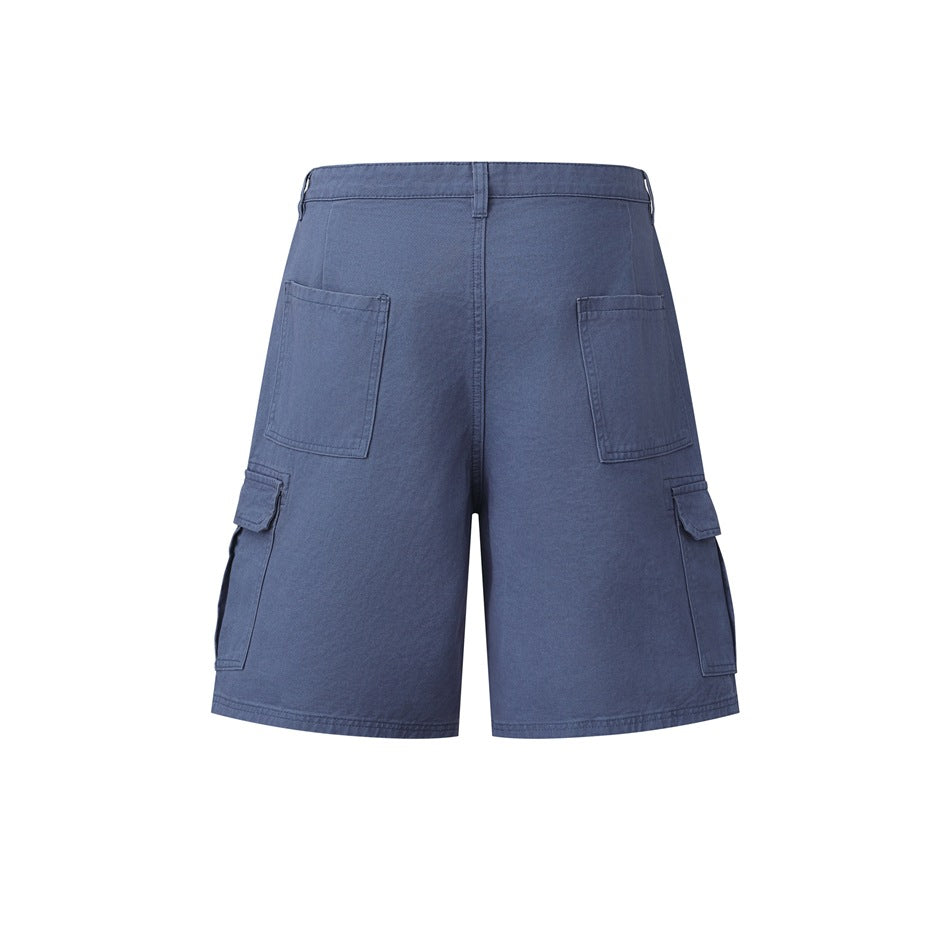 Rear view of blue cargo shorts with two patch pockets, flap cargo pockets, belt loops and a straight hem.