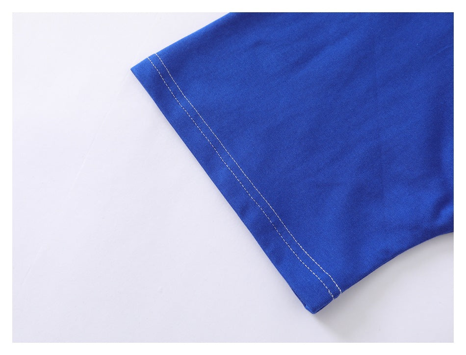 Close-up of a royal blue garment hem with two rows of white stitching.