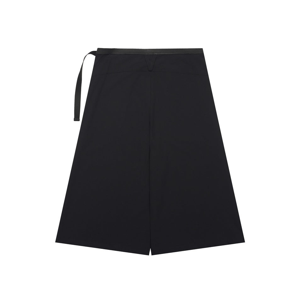 Back view of a black wrap-style skirt with a center seam and a hanging waist strap.