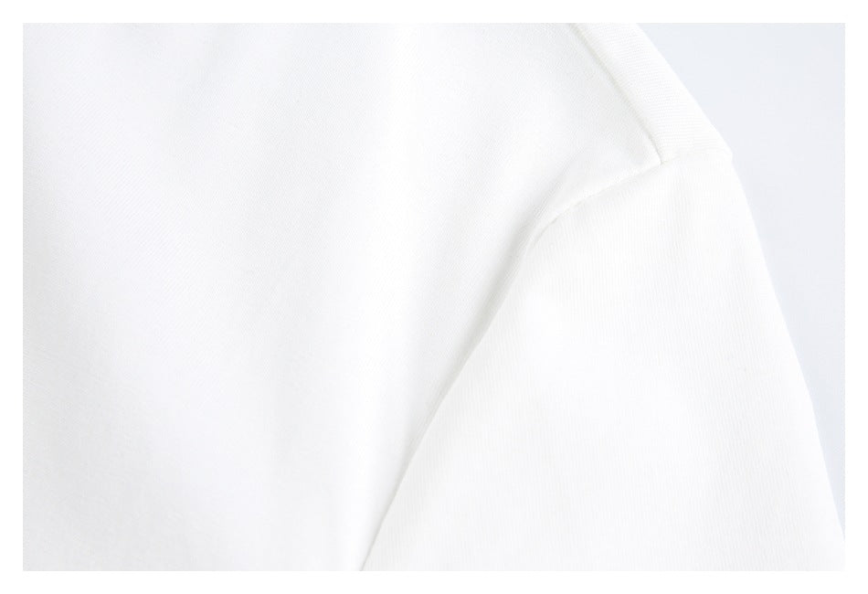 Close-up of a white shirt's shoulder seam and sleeve join.