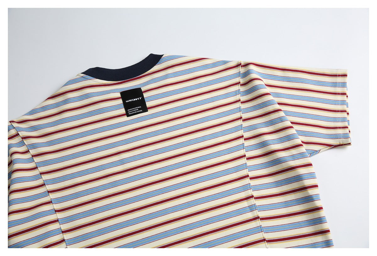 Partial flat-lay view of the striped T-shirt's upper back, short sleeves and dark ribbed neckline.