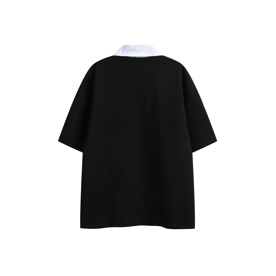 Back view of a black oversized short-sleeve top with a white pinstriped collar.