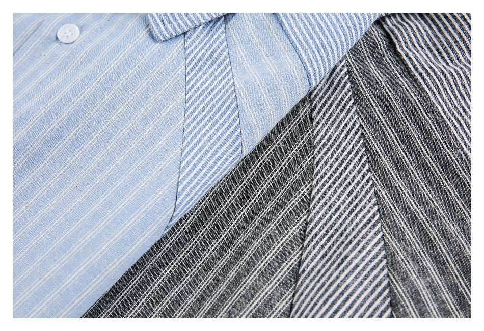 Close-up of light blue and dark gray shirts showing striped fabric and contrasting stripe directions.