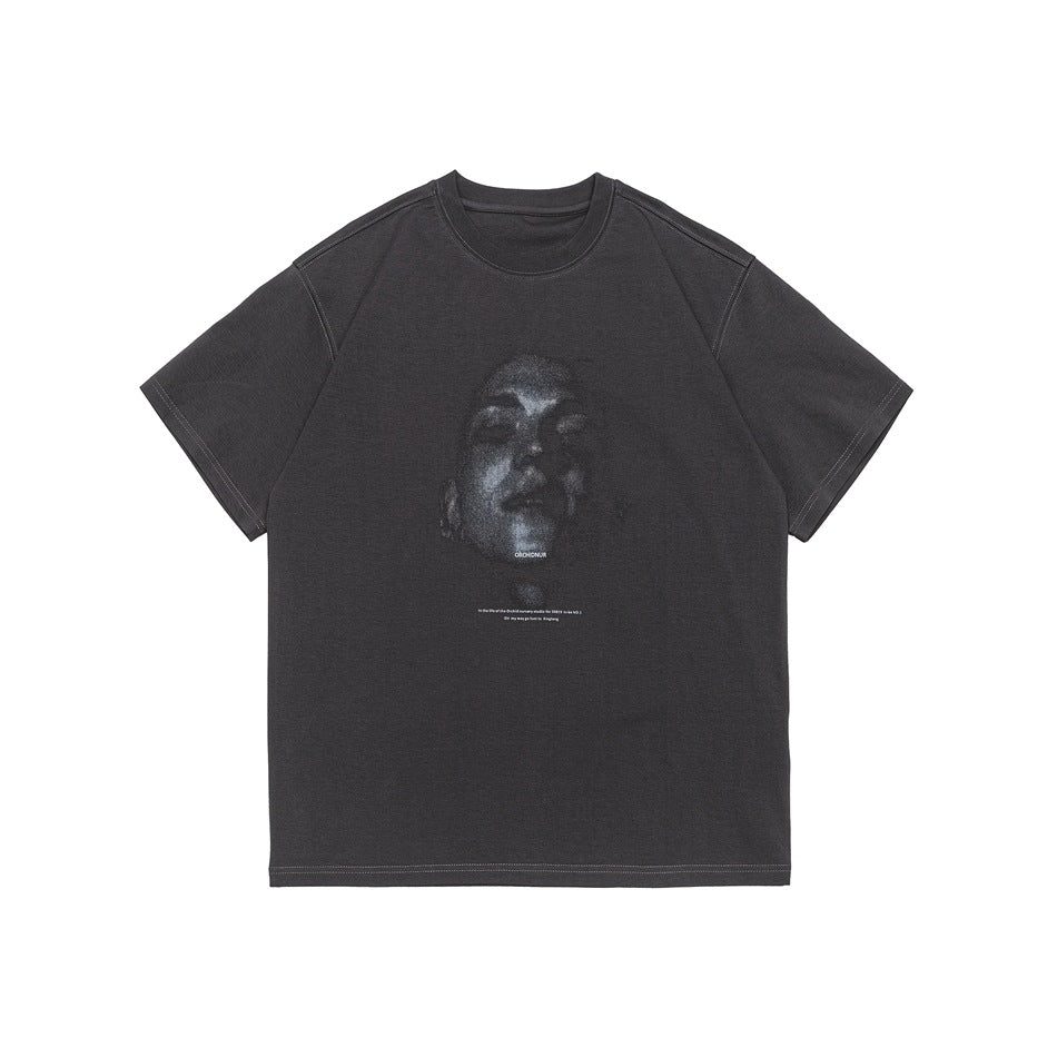 Dark gray short-sleeve crewneck T-shirt with a grainy face portrait graphic and contrast stitching