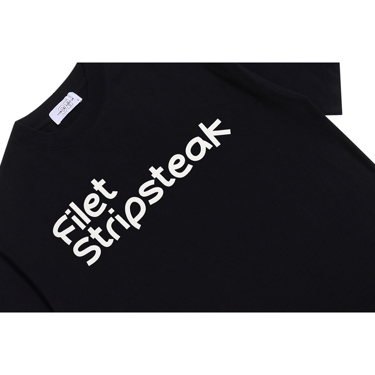 Close-up of the white “Filet Stripsteak” chest print on a black crew-neck T-shirt.