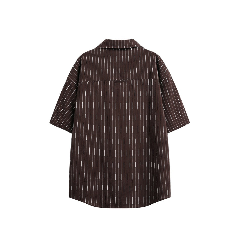 Back view of dark brown short-sleeve shirt with white dashed vertical stripes and a back yoke seam