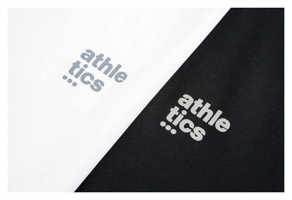 Close-up of gray and black fabric panels with the word “athletics” printed in contrasting lettering.