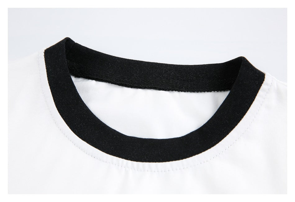 Close-up of a white shirt's round neckline with wide black ribbed trim.