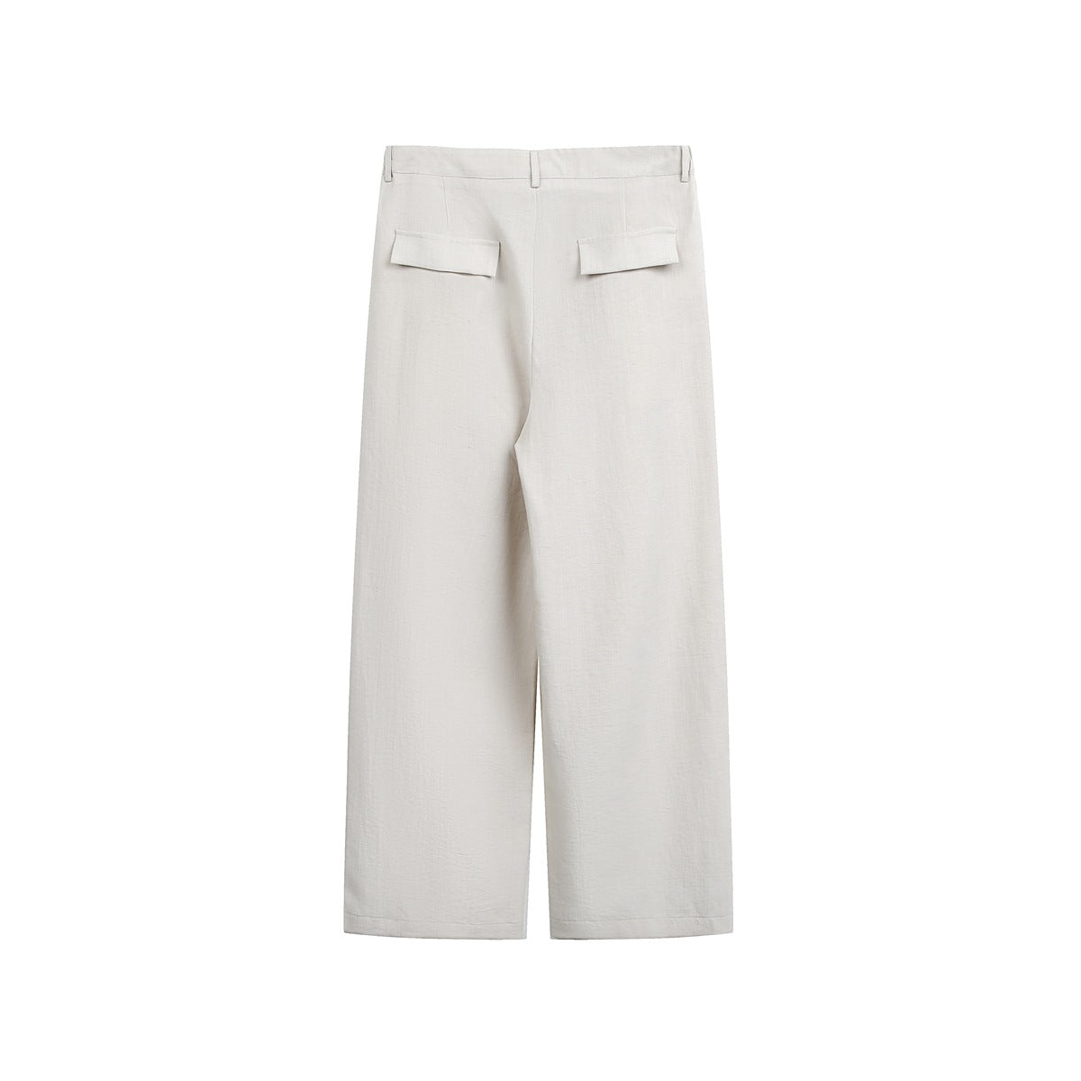 Rear view of loose ivory trousers laid flat, with belt loops and two welt pockets with flaps.