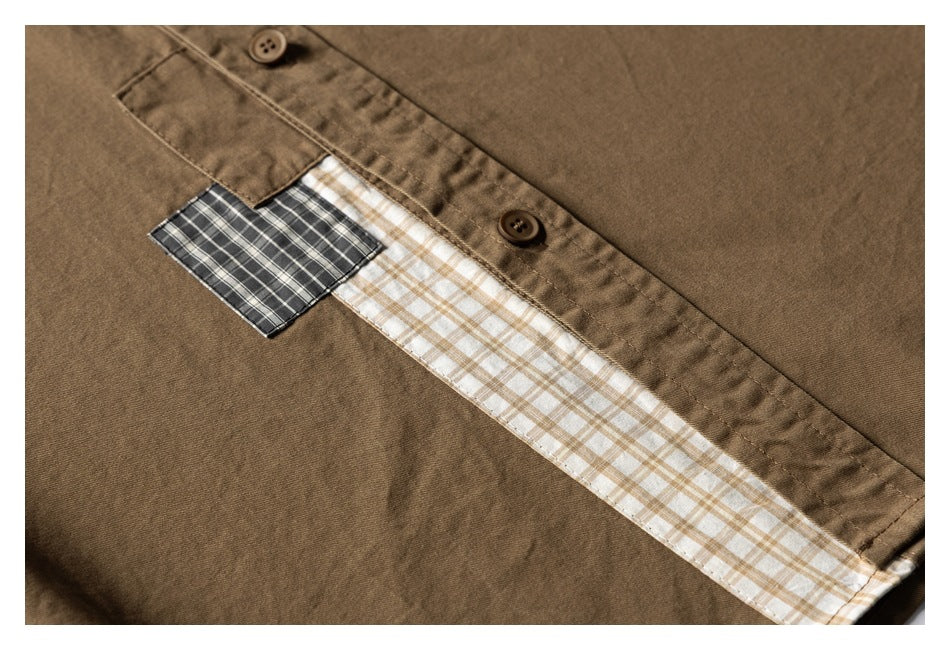 Close-up of a brown shirt's button placket with beige and dark plaid fabric accents.