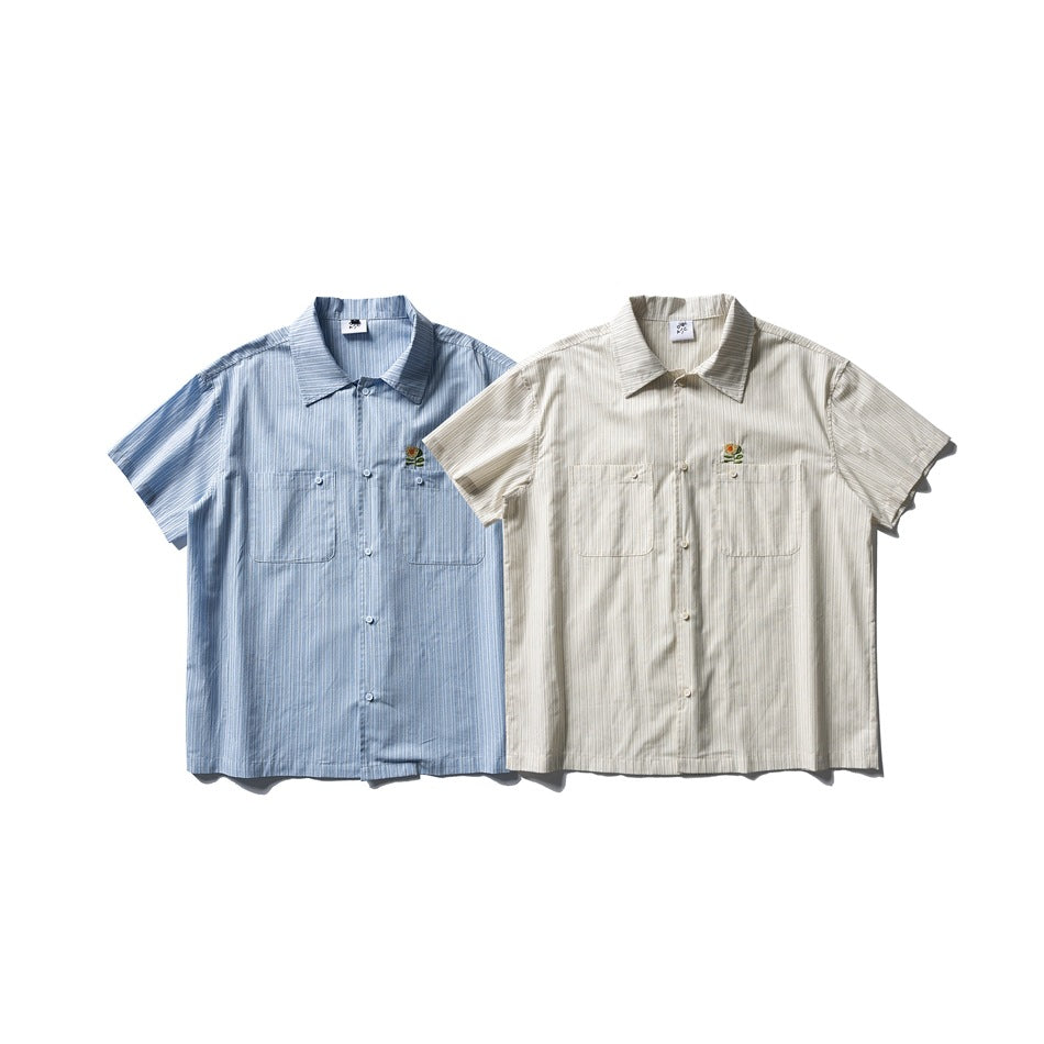 Two short-sleeve striped button-up shirts shown from the front in blue and cream, each with two chest pockets.