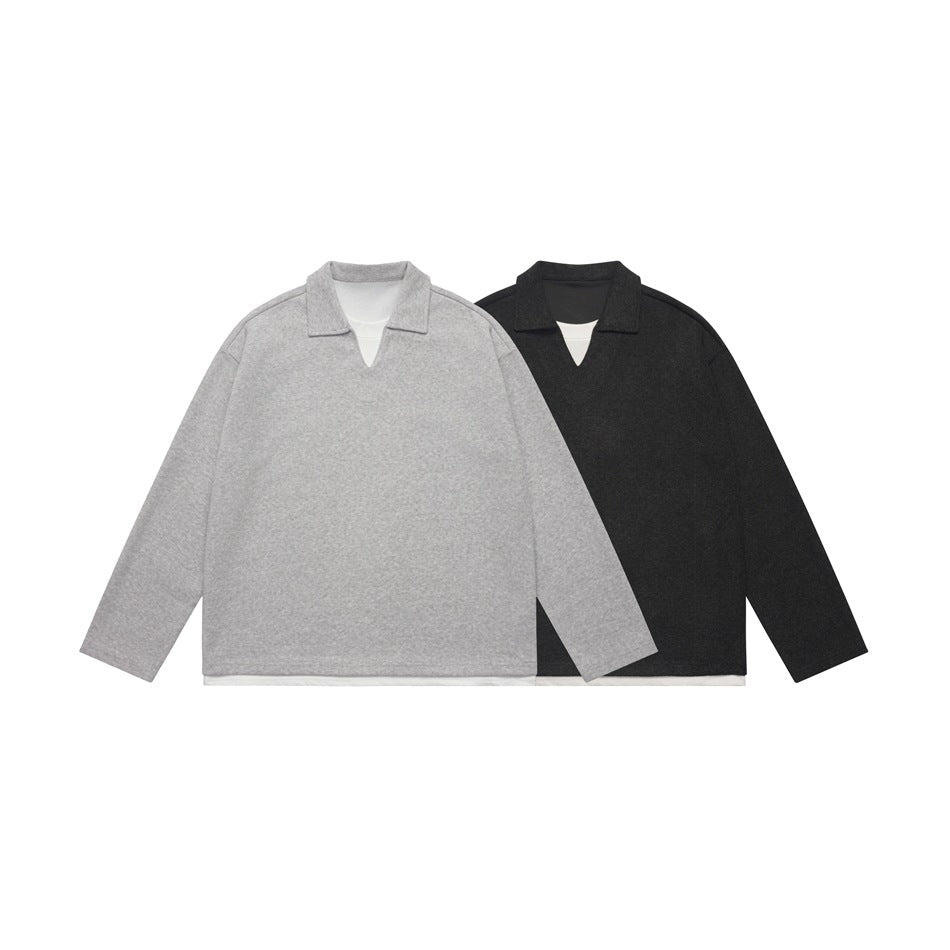 Front views of light gray and black long-sleeve collared tops with V-shaped necklines and white layers peeking out.